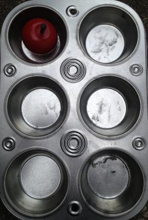 red apple in dot 1 position of muffin tin