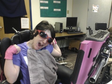 Student using AAC device to write