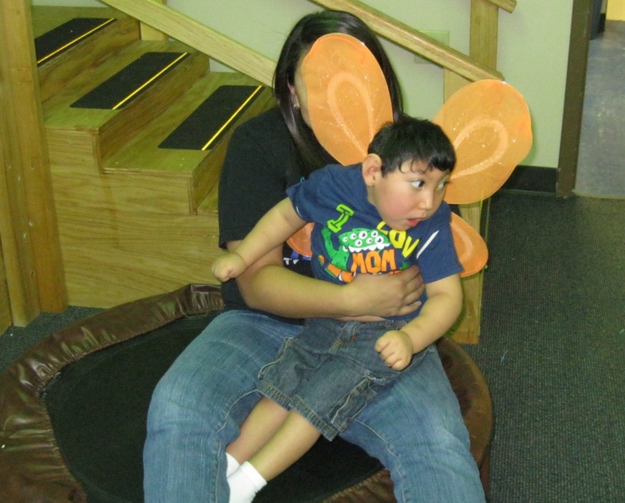 A child wearing butterfly wings