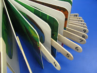 Using numbered tongue depressors as page fluffers on a board book.