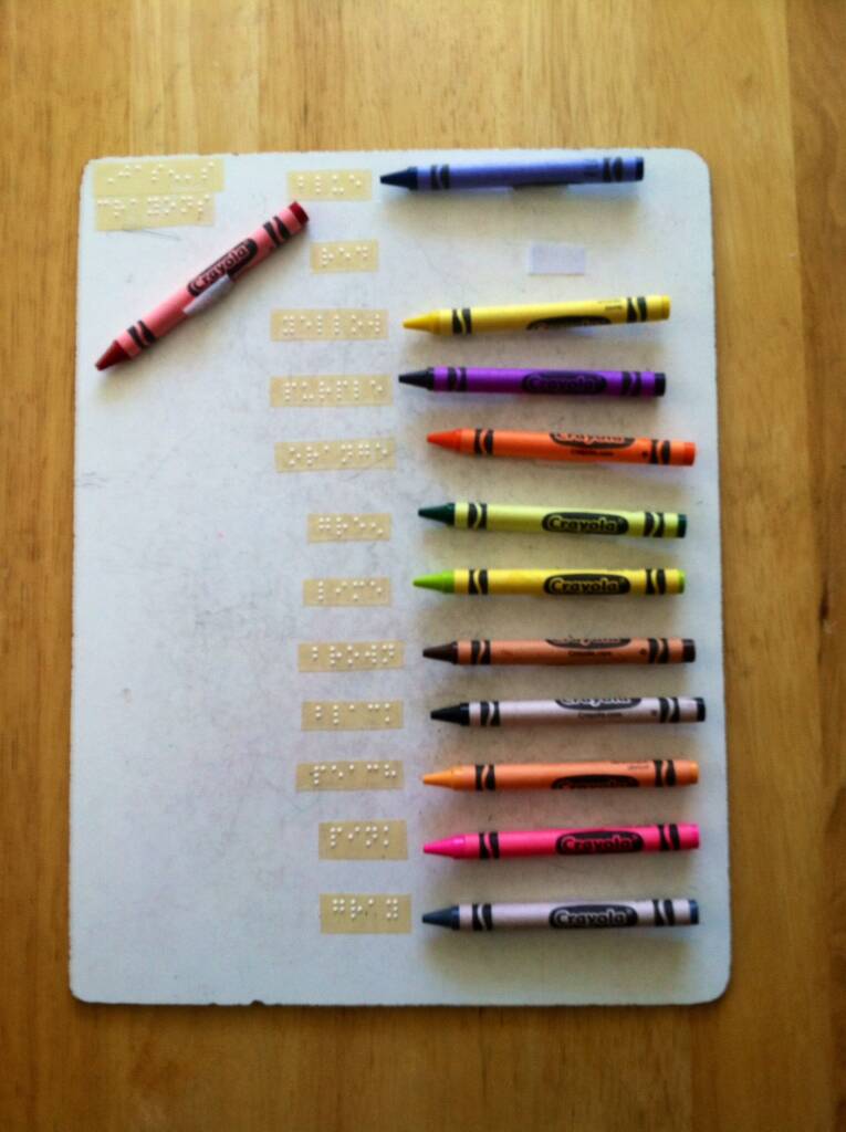 Crayon board with braille labels
