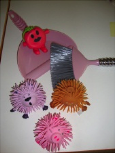 four model dust bunnies, broom and dust pan
