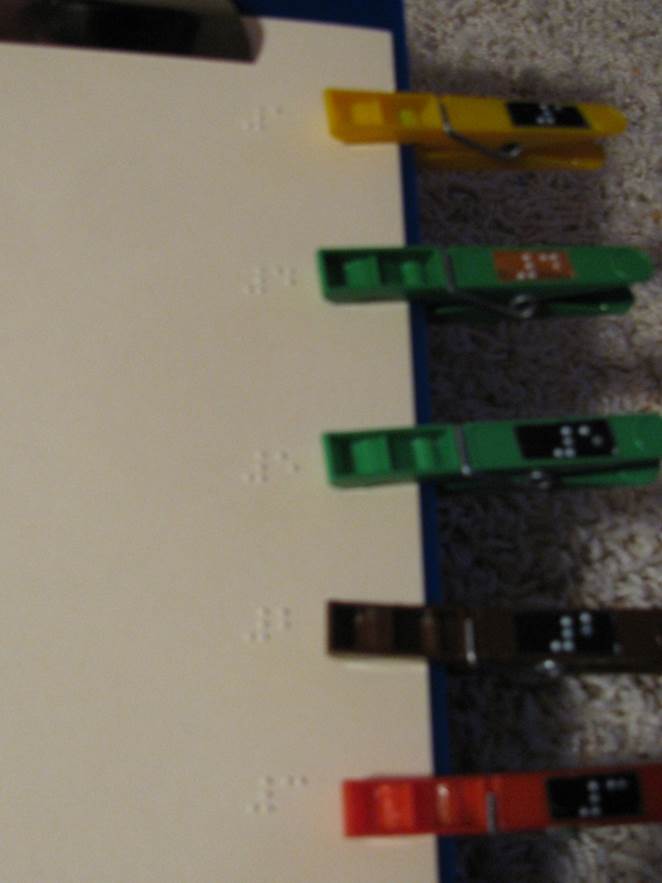 Clothespins with braille words