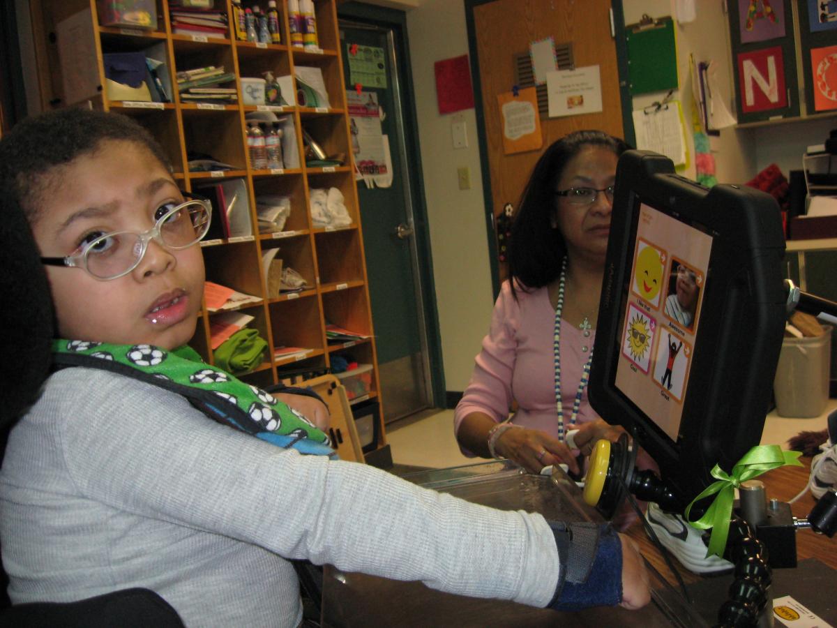 student using an iPad for communication