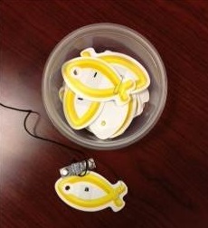 Paper fish in a plastic cup