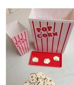 a popcorn holder with bingo pieces 