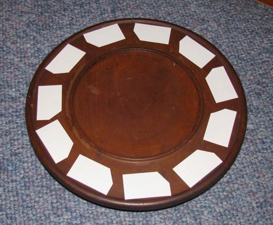 a lazy susan serving dish with braille cards on it