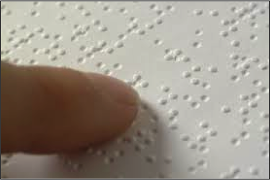 finger over braille