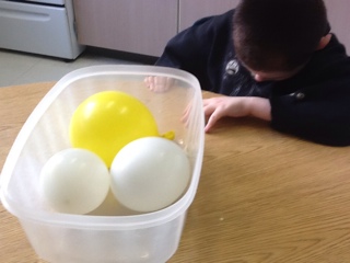 water balloons in Tupperware container