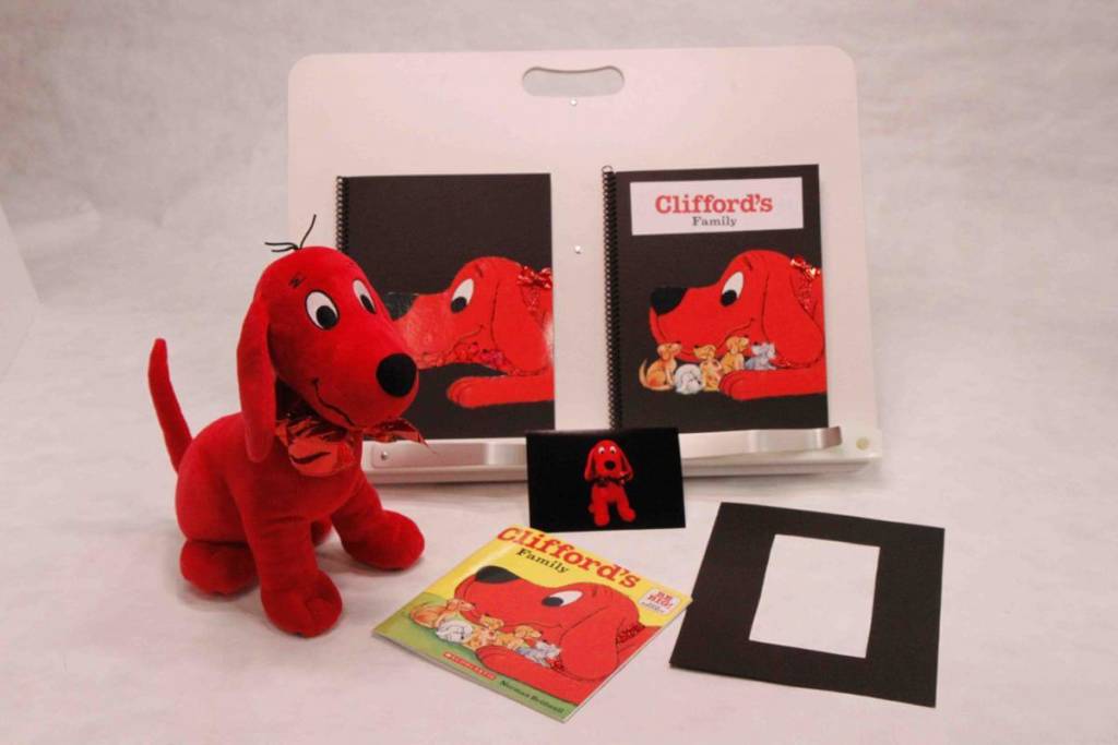  “Clifford’s Family” adapted for children with CVI with red image on black background and stuffed dog.