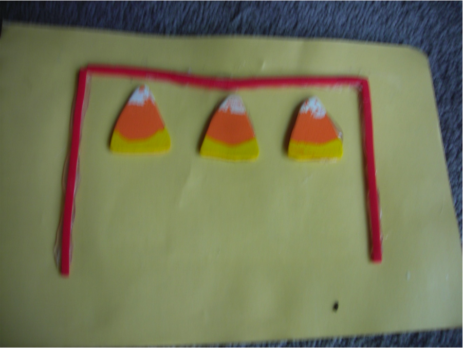 pieces of candy corn inside a present