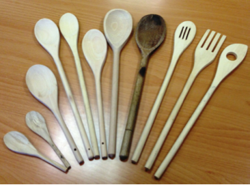 spoons and kitchenware lined up smallest to largest