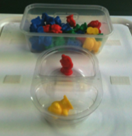 food containers filled with figurines.