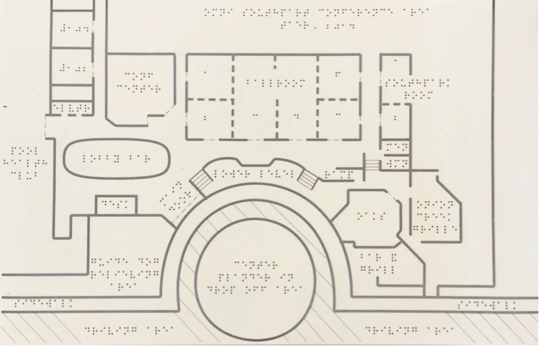 Tactile map on swell paper with floor plan that includes braille map title and room labels