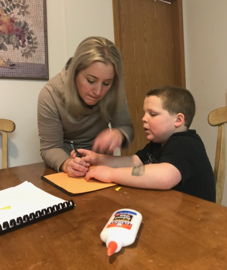 Click to enlarge the picture of Liam and me working on a project. Liam and his mom working on art projects