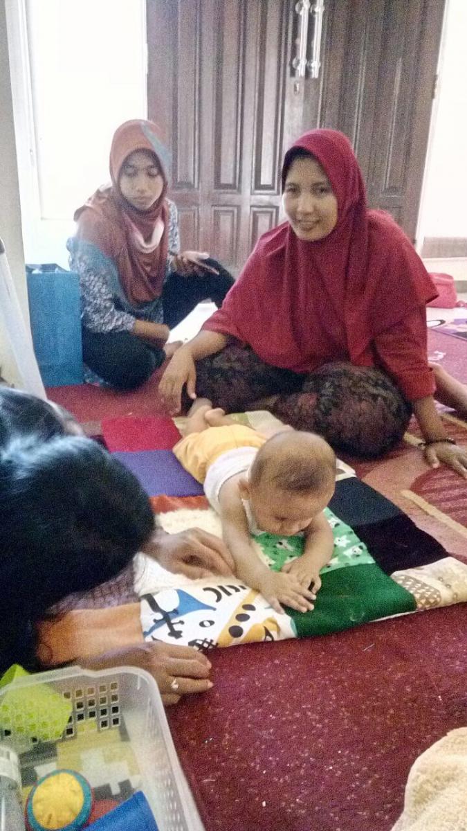 Mothers in Indonesia at Baby Camp using tactile blanket