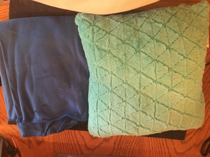 a pillow and blanket for the story box 