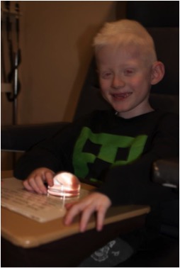 A boy using a dome magnifier