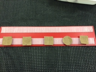 Bumpy square pieces on track