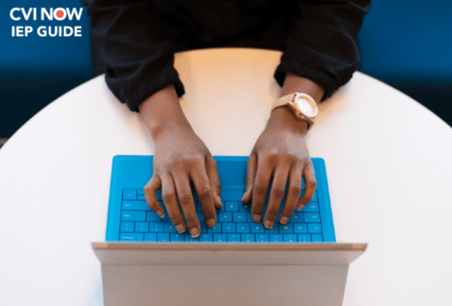 Hands typing on a keyboard 