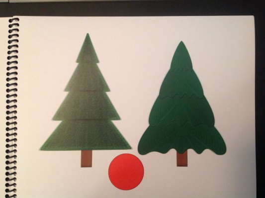 two green pine trees with a red ball between them