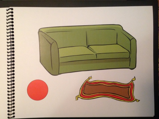 a green sofa, a small rug, and a red ball