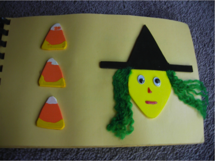 Page from tactile Halloween book with candy corn and witch's face