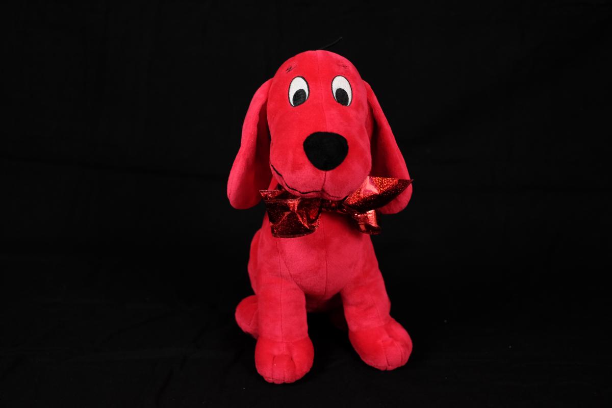 The red mylar ribbon around Clifford's neck is a salient feature. Clifford with red mylar ribbon around his neck