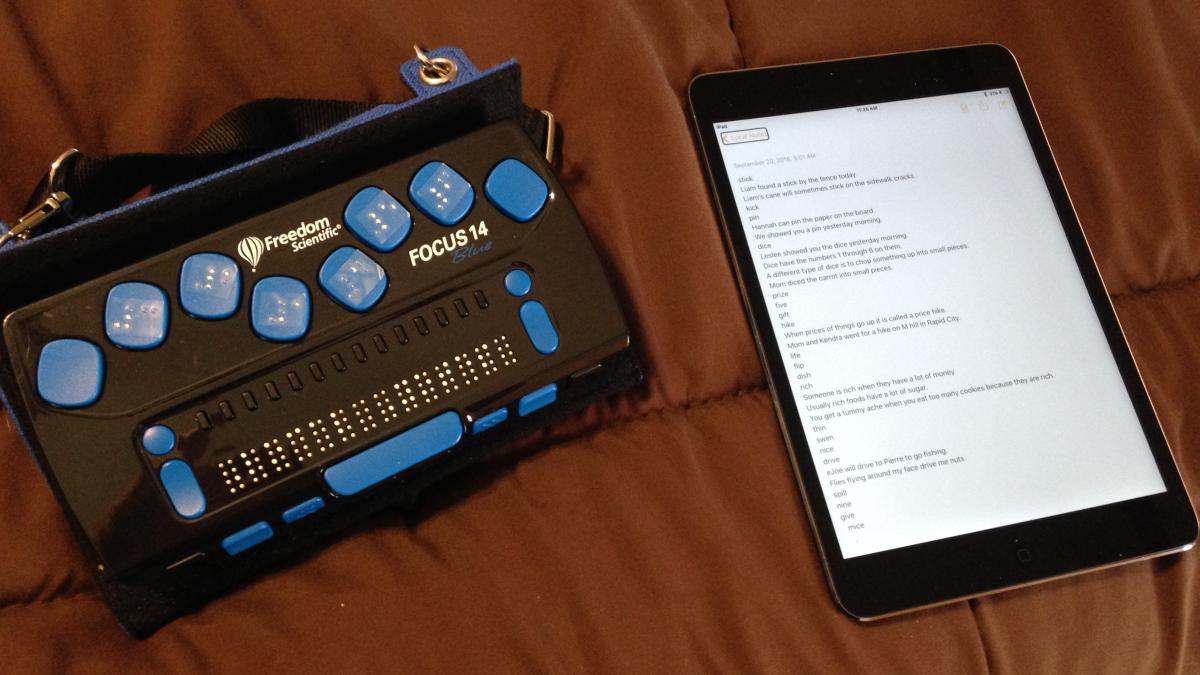 A Focus 14 refreshable braille display with an iPad