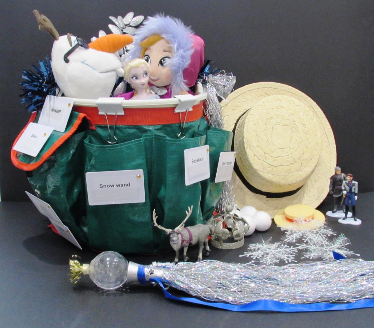 Bucket full of characters and materials for Frozen activity