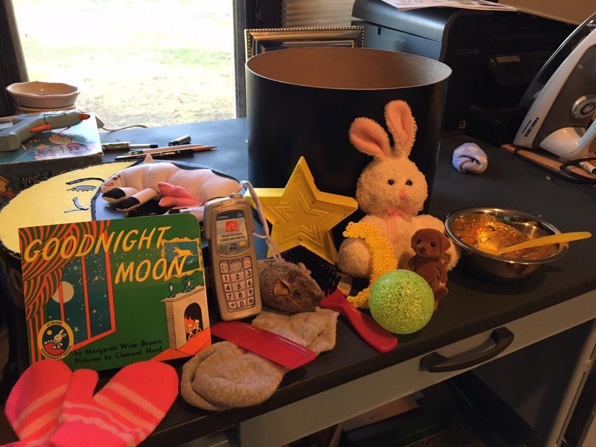 Click to enlarge the story box. story box contents including tactile objects and the story book