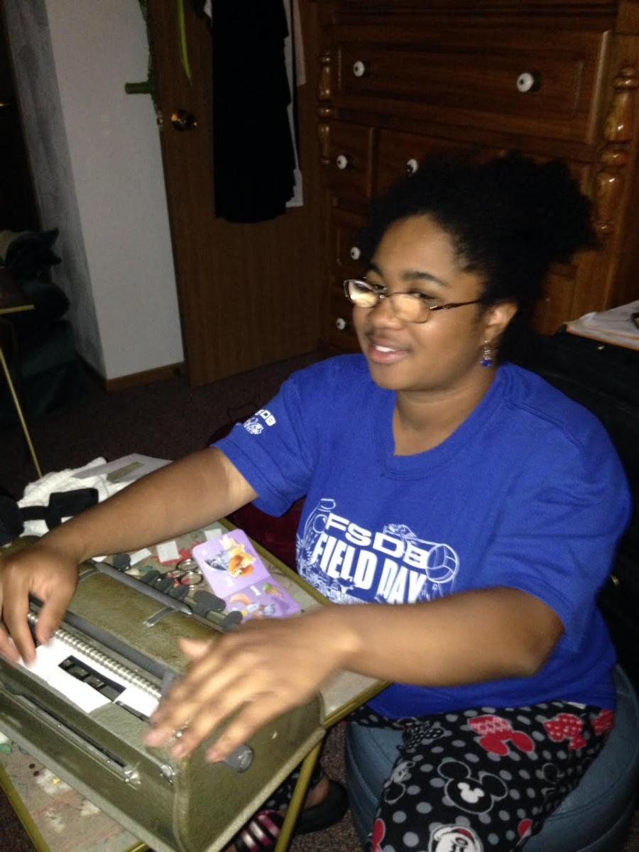 The author using a braillewriter The author using a braillewriter