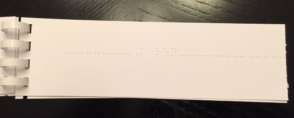 Book with line of braille to track 