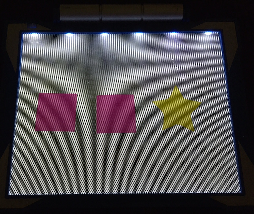 light box with 2 pink squares and a yellow star