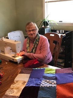 Pat Jacobs sewing a tactile blanket