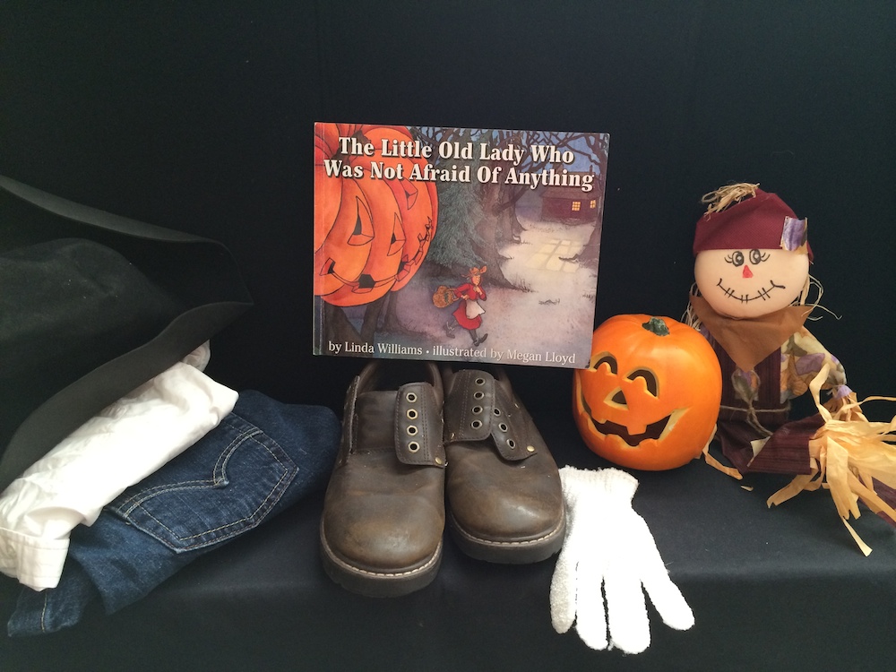 Little old lady book, with boots and a pumpkin and a mini scarecrow