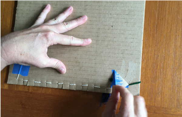 Removing tape from back of loom