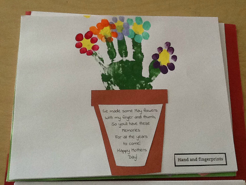 may calendar picture with hands and fingerprints made into flower