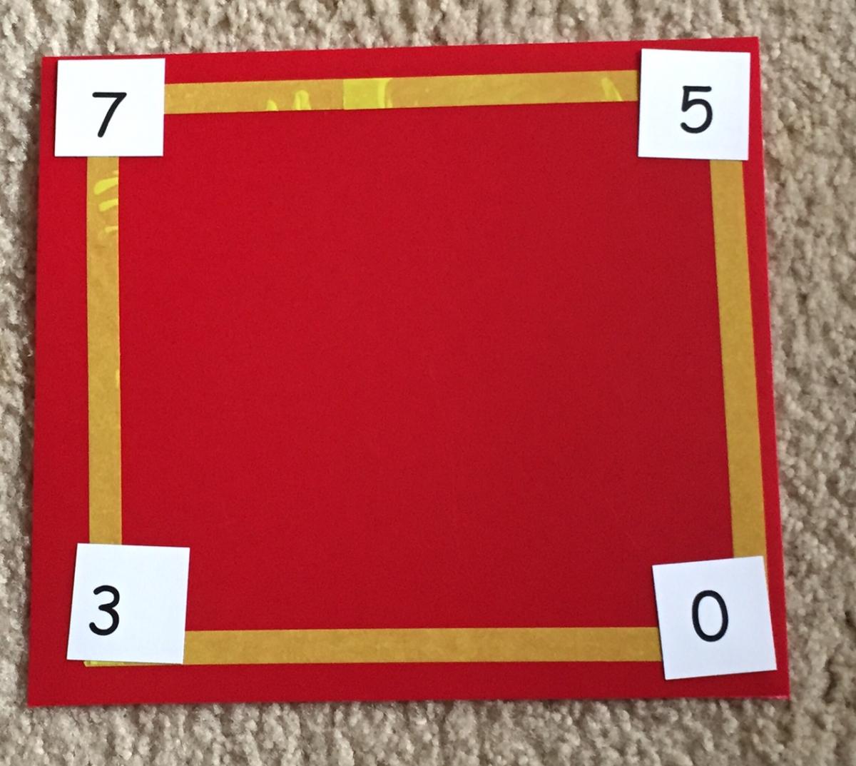 monocular numbers on red background with yellow tape