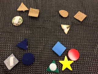 Image of multiple shaped pieces made from cardboard, plastic, and paper