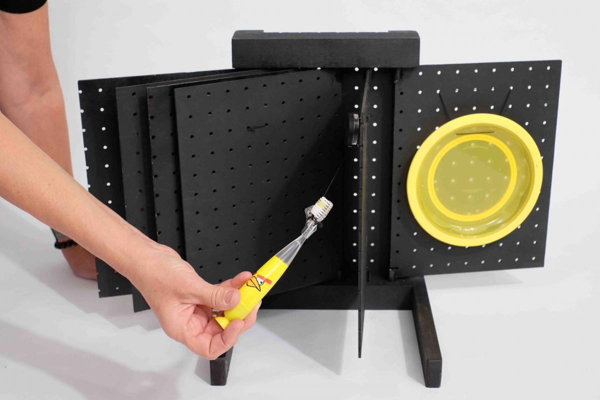 Pegboard book with toothbrush