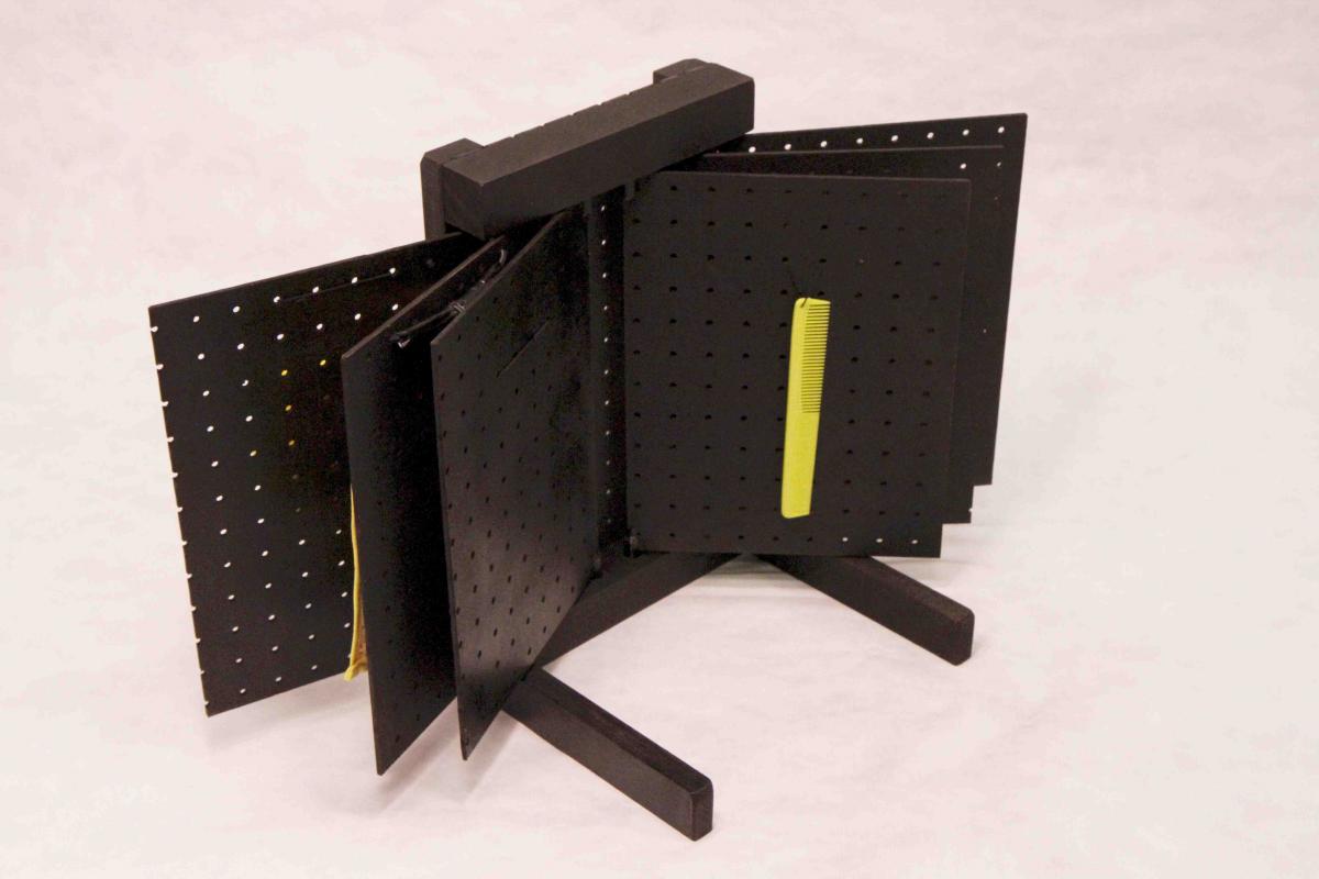 pegboard book with yellow comb