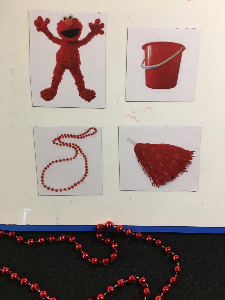 Shiny red beads with picture cards