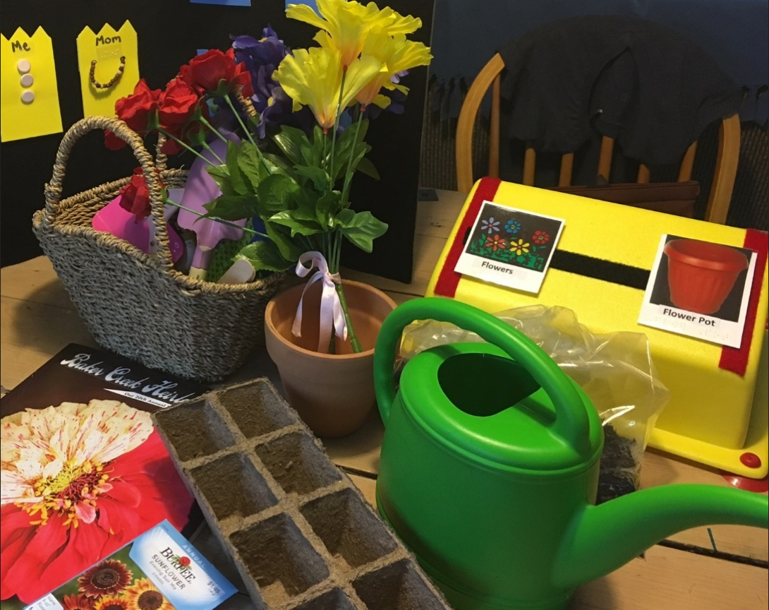 Garding tools, watering can, flowers, basket, and a few tactile cards 