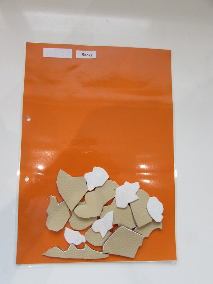 tactile rocks on orange paper