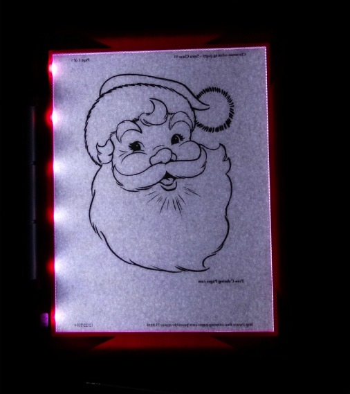 light up pad screen with a santa drawn on it