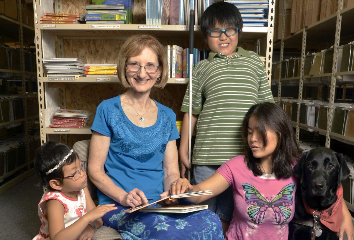 Seedlings founder Debra Bonde with a group of braille readers
