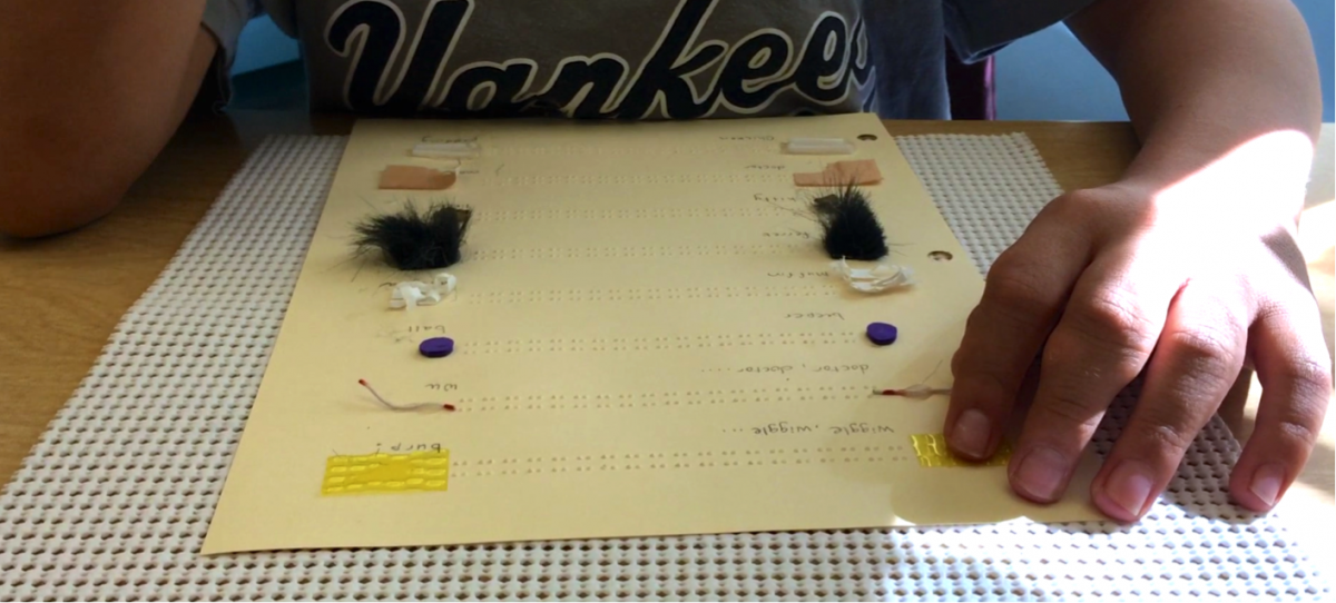 student using a micro tactile symbols page
