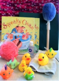 Kit includes a loofah, rubber duckies, hand sanitizer, and a back scrubber