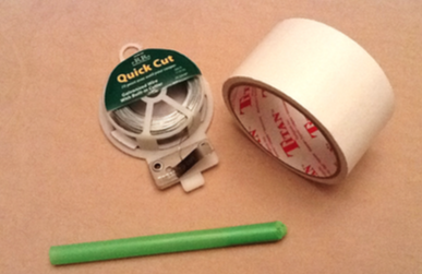wire and tape and a straw with the sponge squeezed in